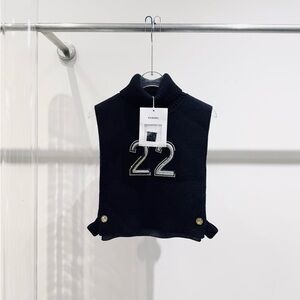 Authentic CHANEL Black Knit Sleeveless Mock Neck Front '22' Patch Vest
